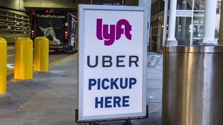 A sign indicating an Uber pickup area.