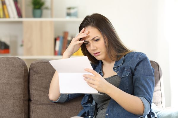 Woman reading letter for Atlanta car crash claim