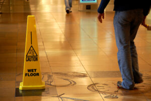 Premises Liability Lawyer Charlotte, NC - Caution Wet Floor sign in a shopping mall