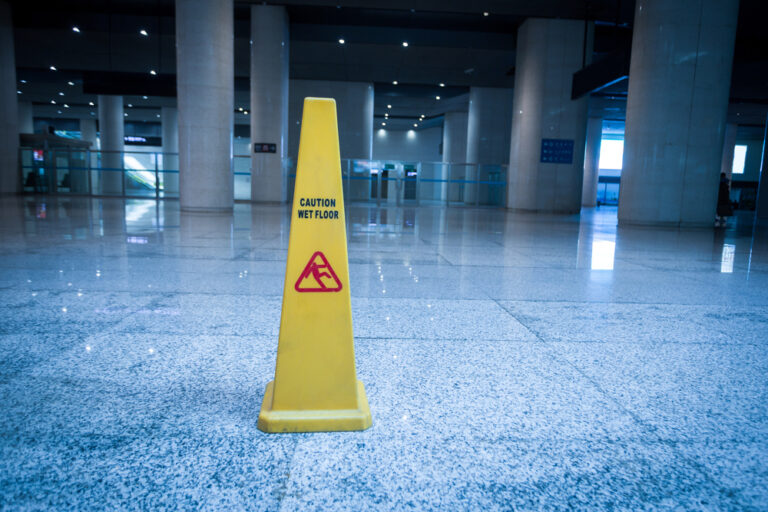 Trip and Fall Lawyer Charlotte, NC - slippery sign on floor of modern building