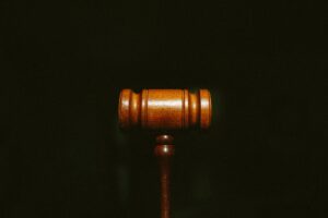 Wrongful Death Lawyer Charlotte, NC - A wooden gavel centered on a dark background with grain.