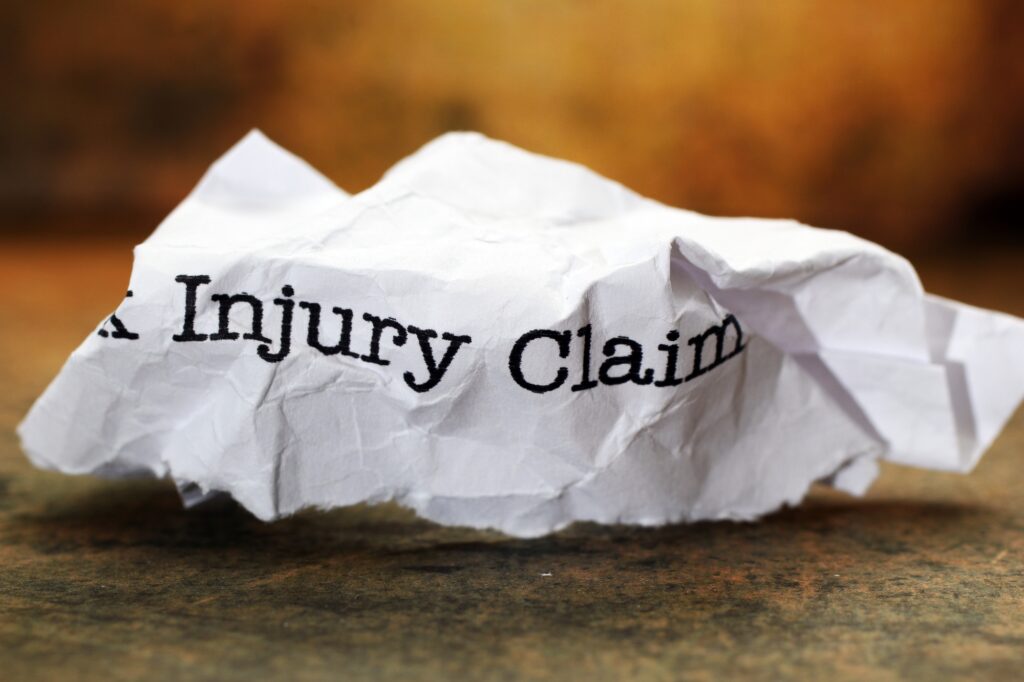 Personal injury claim typed on crumpled paper