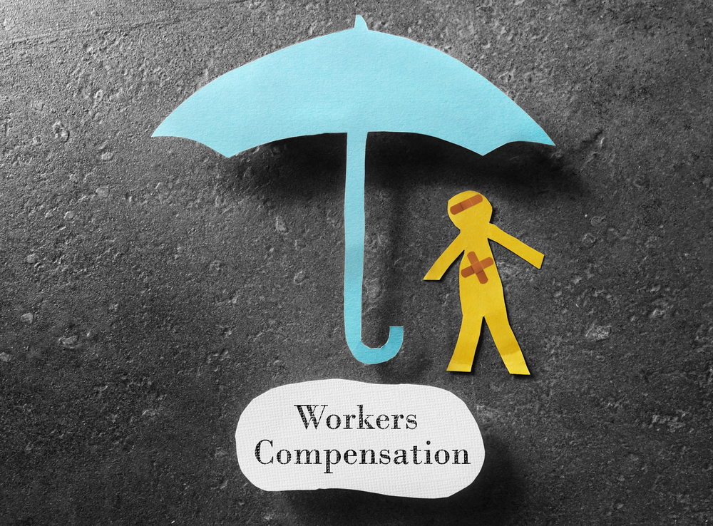 Workers' Compensation Benefits And Pursuing A Third-Party Claim - bandaged paper man under umbrella with Workers Compensation note below