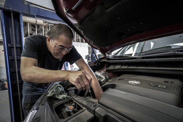 man working on car at auto repair shop